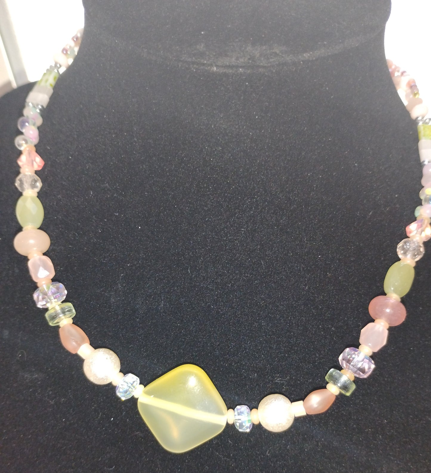 Light orange/yellow/pink beaded necklace with heart and pearl beads